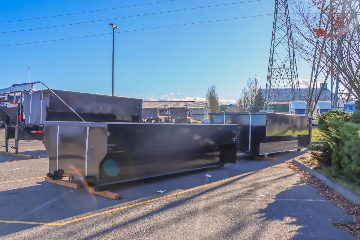 Roll-off dumpster ready for waste disposal at job site for 2 Yard Dumpster Rental in Florence